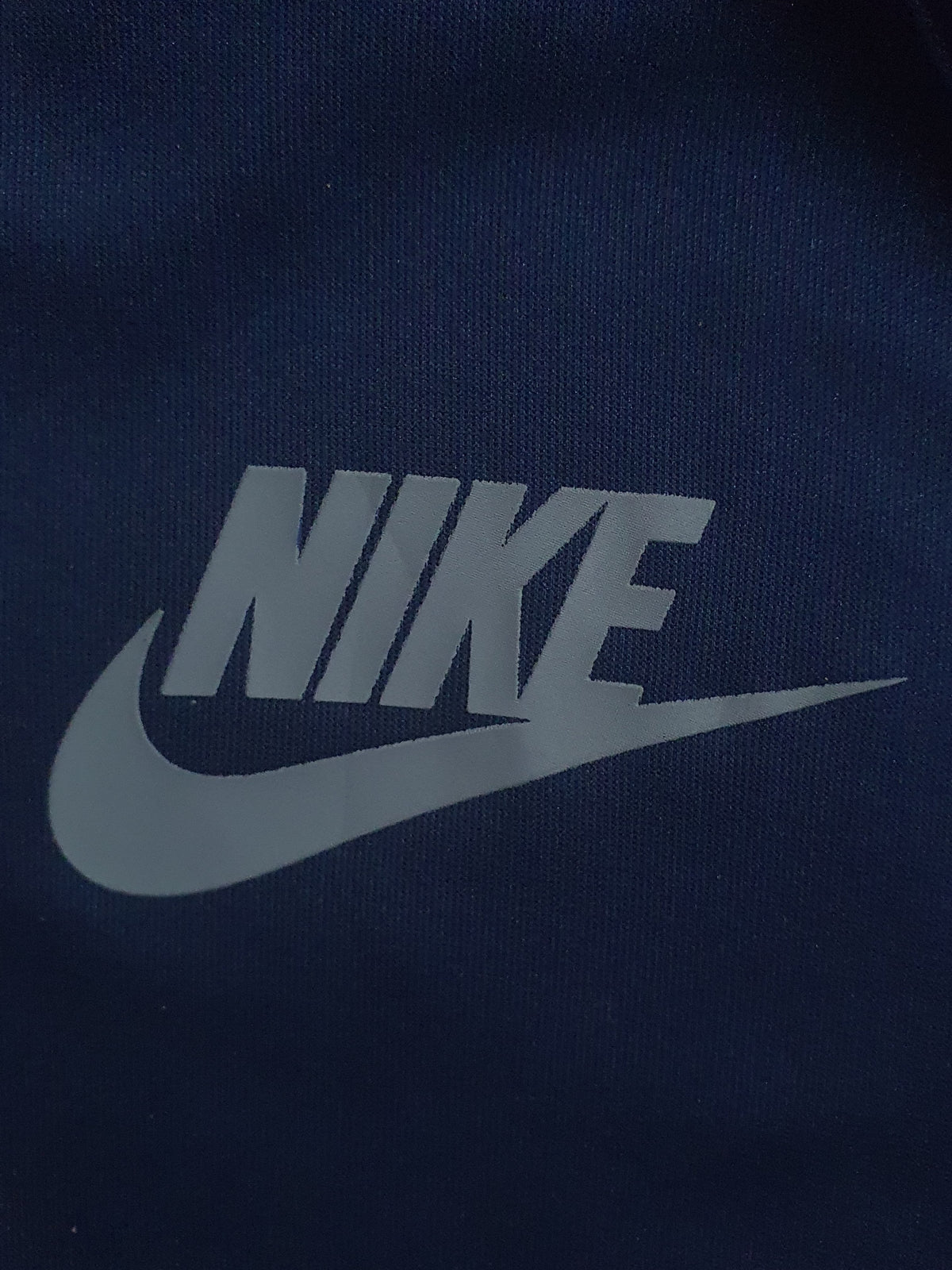Nike zip-up track jacket with a hood