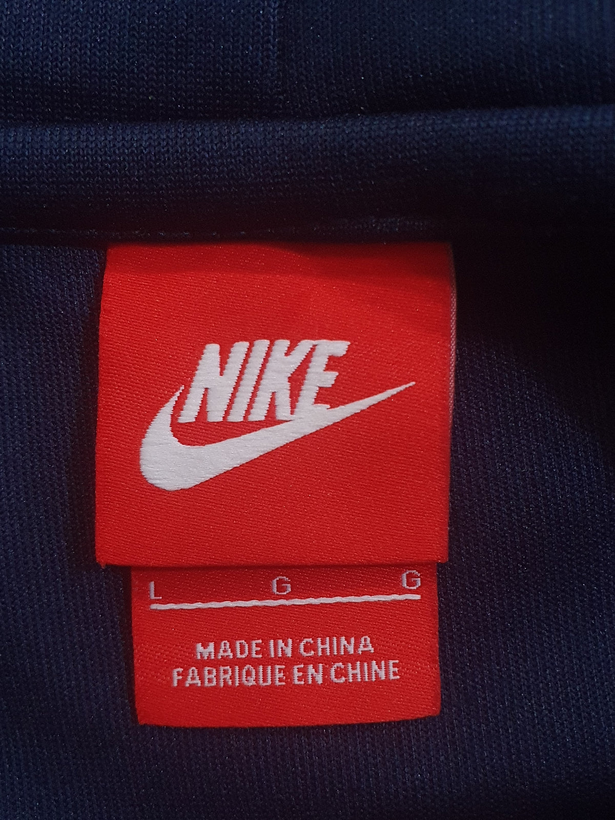 Nike zip-up track jacket with a hood